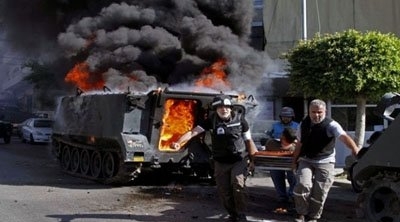 مقتل 12 جنديا لبنانيا في المعارك مع اسلاميين متطرفين في صيدا 