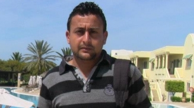 عون أمن يحاول الاعتداء على مصور قناة الحوار أمام التأسيسي