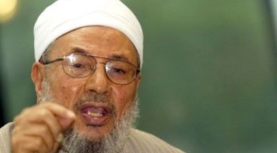  القرضاوي :  الخروج على مرسي حرام شرعا 