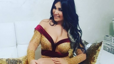 بالصور : نجلاء التونسية بفستان جريء 